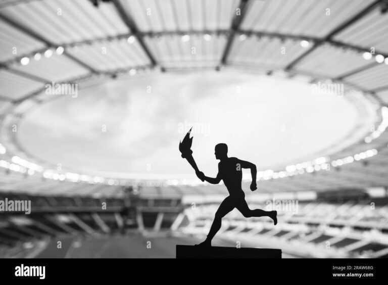 flamme olympique illuminant un stade 1